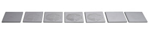 Contemporary art wall pieces of 7 squares of concrete with different reliefs and variance of the image of feminity.
