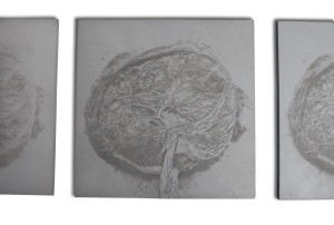 Close-up view of 1 of 7 contemporary art wall pieces of square concrete with different reliefs and variance of the image of feminity.