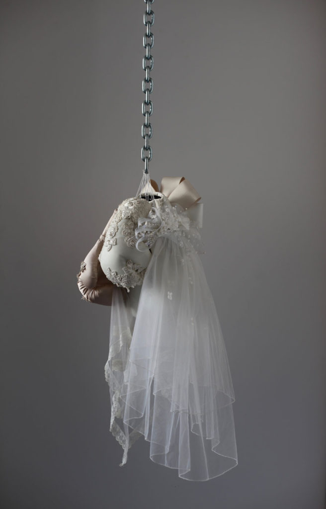 Boxing glove and wedding dress sculpture by Zoe Buckman