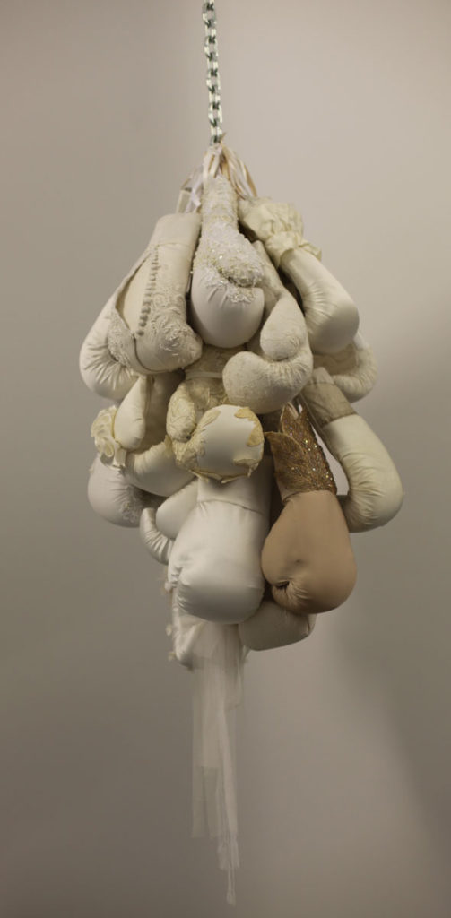 Cluster of boxing gloves with wedding dress details are sculpture by Zoe Buckman