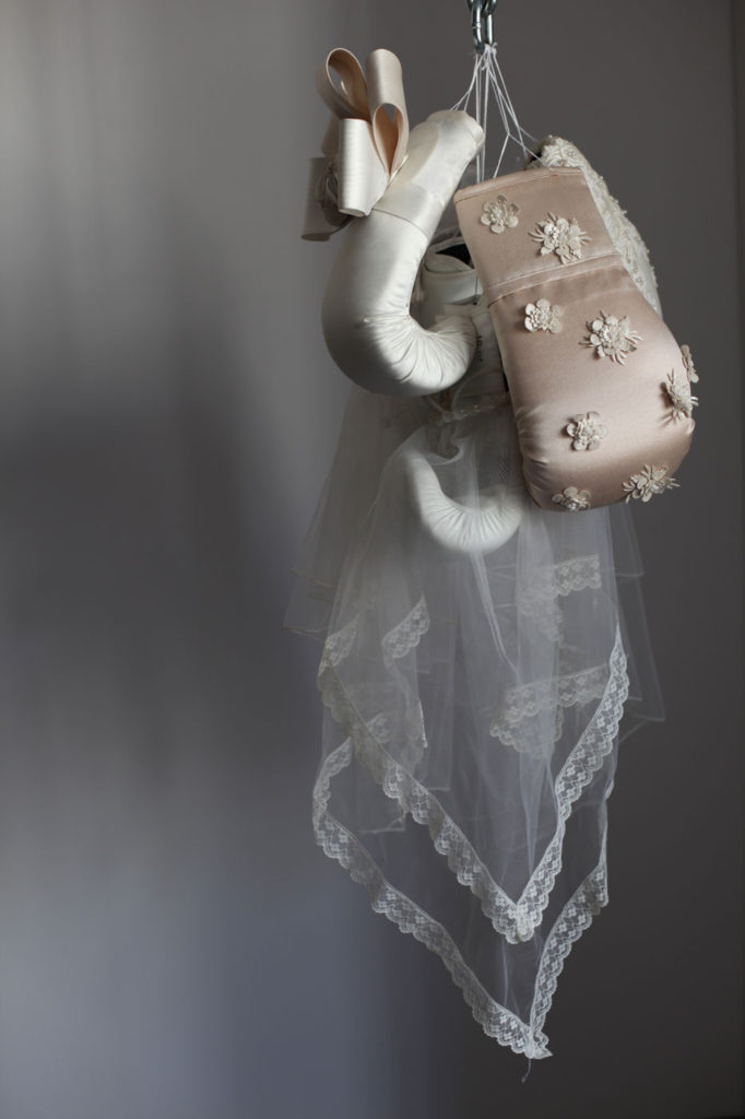 Wedding dresses cover boxing gloves in feminist sculpture