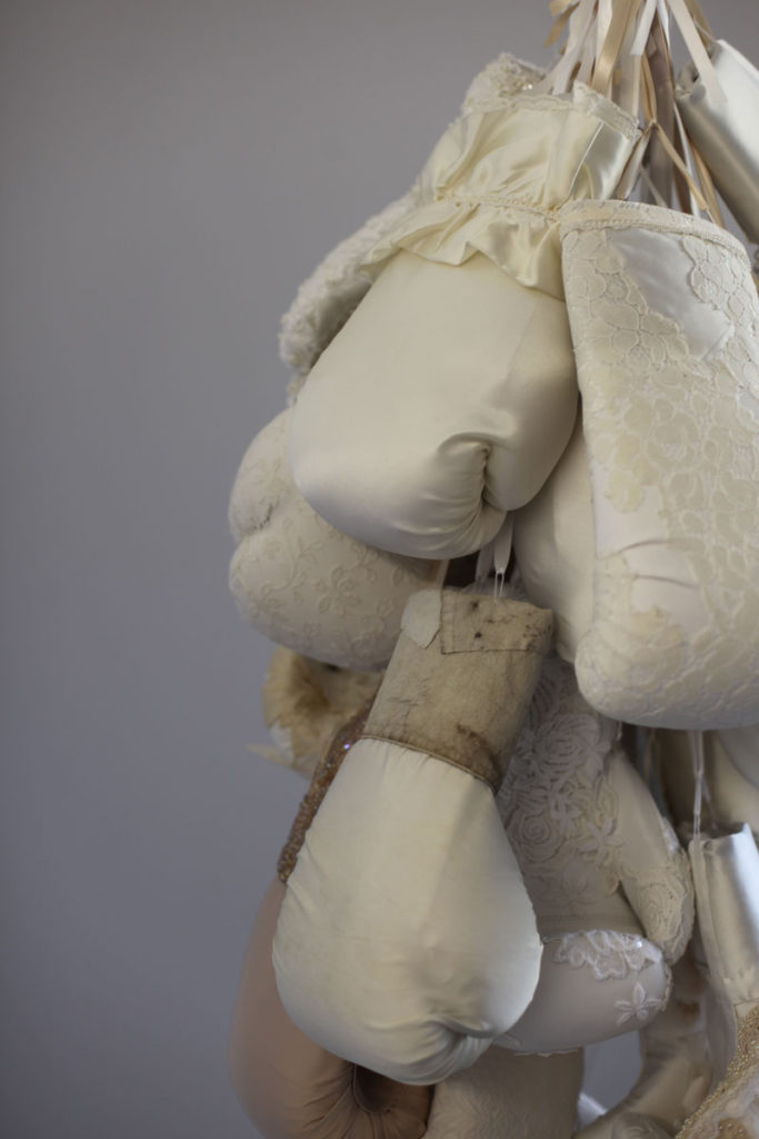 Contemporary fiber sculpture by feminist artist Zoe Buckman features boxing and weddings